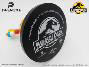 Jurassic Park branded product with Paragon PX Group logo on a white background. Jurassic Park Mr. DNA Authentic Movie Prop Replica at The Academy Museum Store Los Angeles